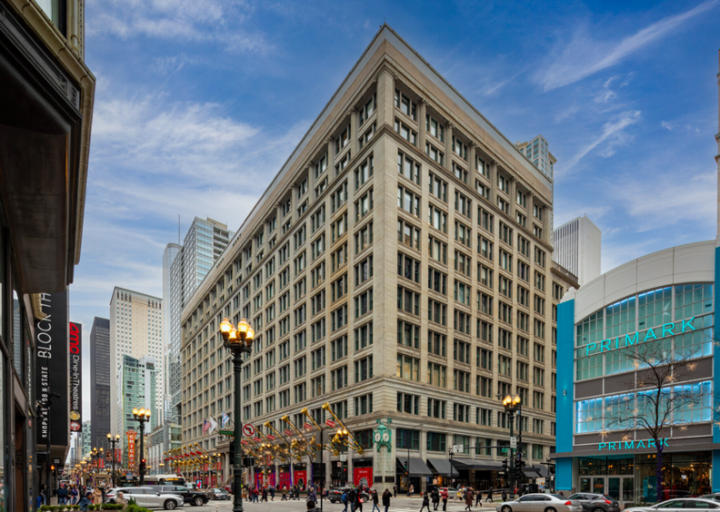 Logistics company planting flag at Marshall Field building